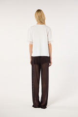 SK White Blouse With a Golden Brooch