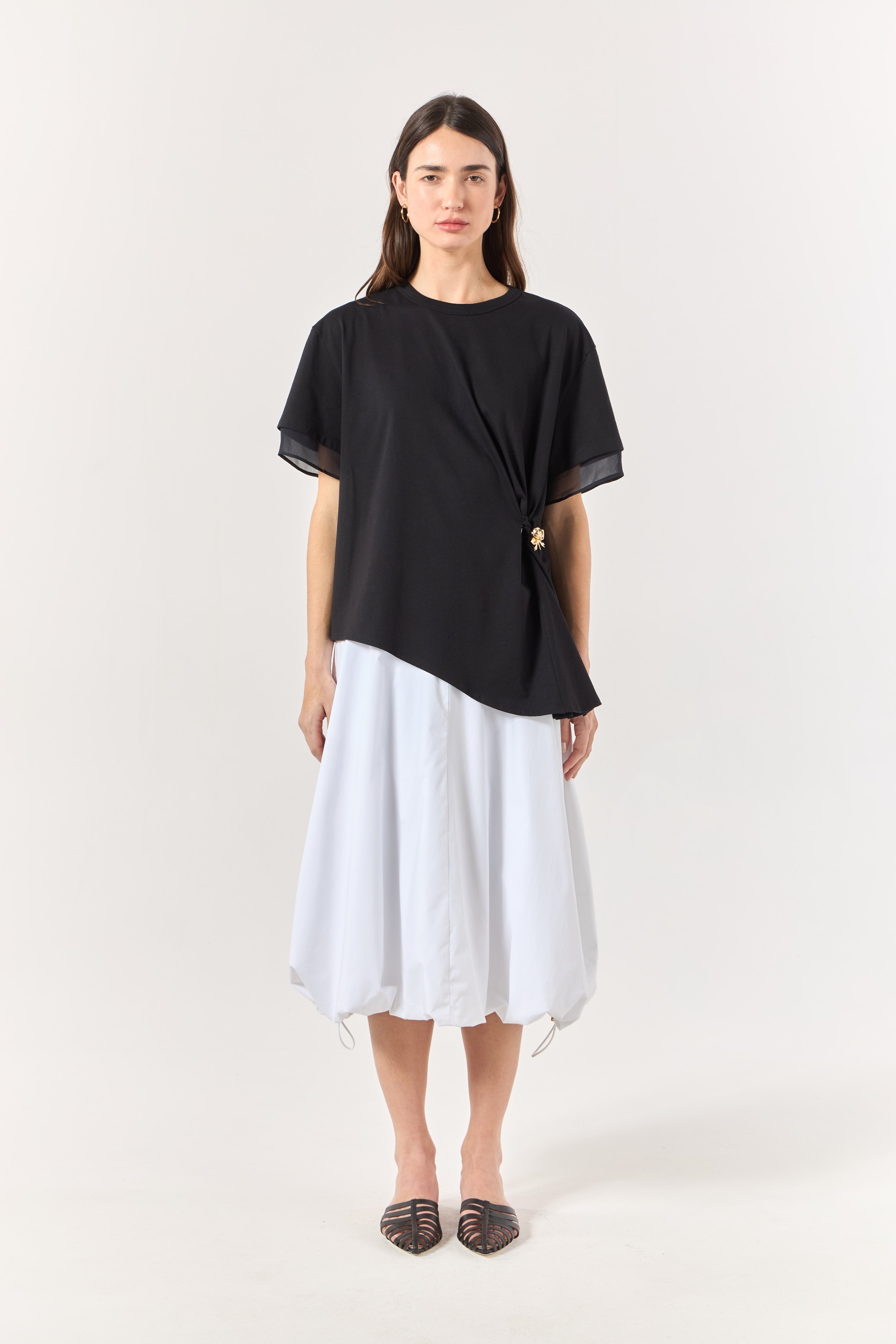 SK Black Blouse With a Golden Brooch