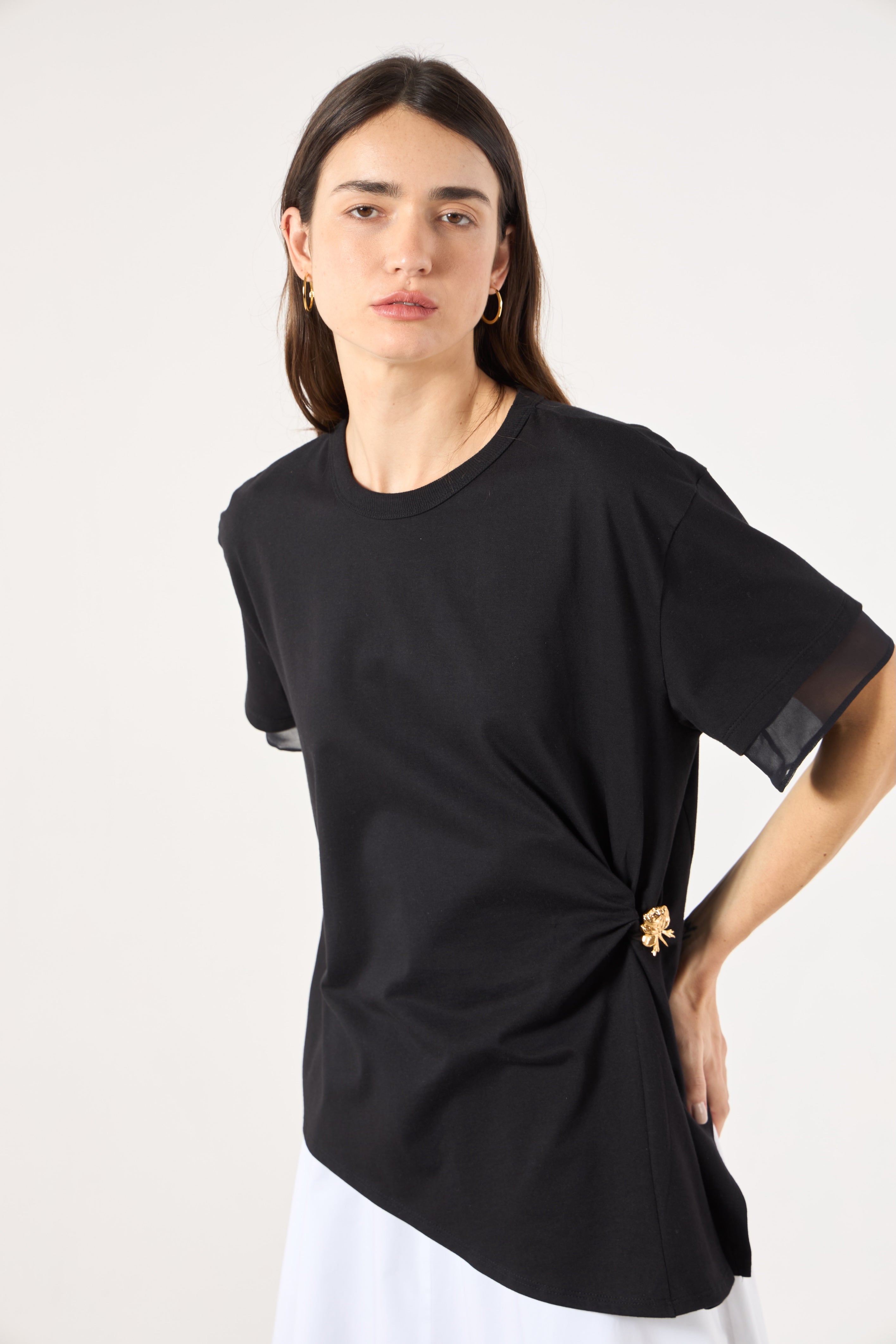 SK Black Blouse With a Golden Brooch